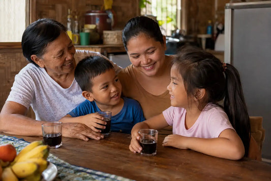 Three generations of a Filipino family sharing a morning wellness ritual with PhilNONI noni juice
